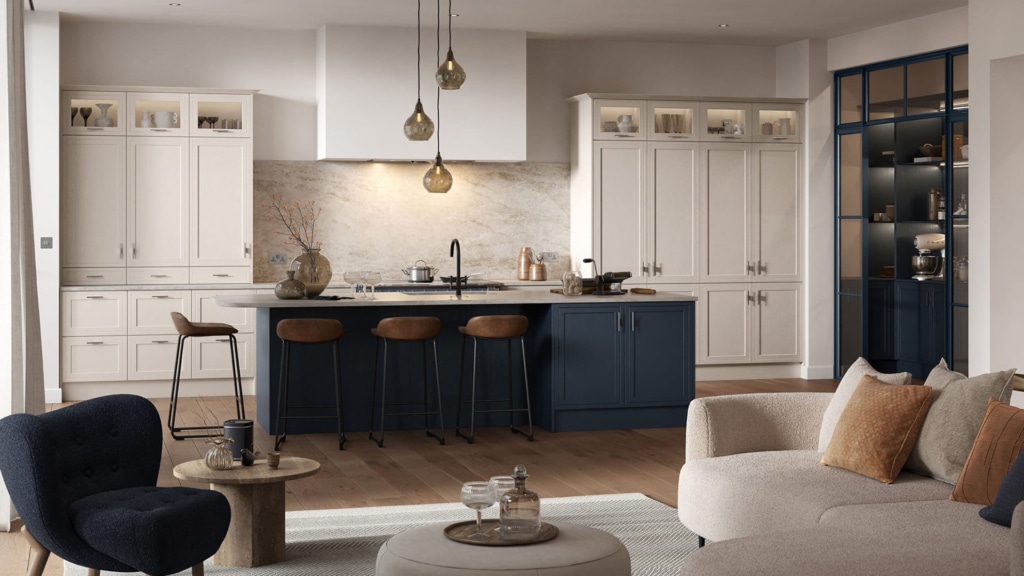 A modern kitchen featuring a dark blue counter in the center with a marble worktop.