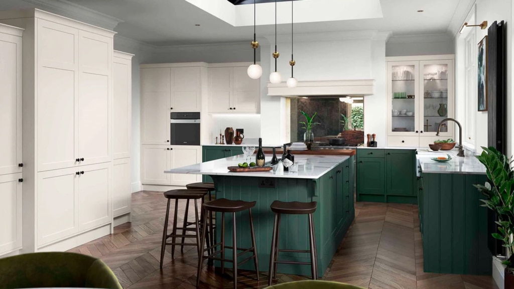 The Clifden kitchen range in heritage green with white marble worktops.