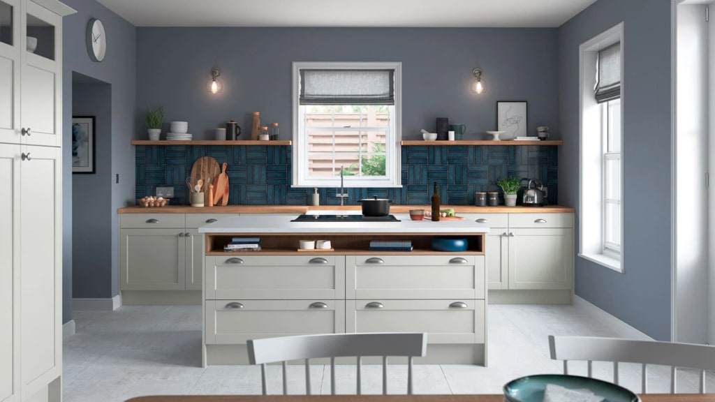 The Dawson kitchen range in light grey with oak worktops.